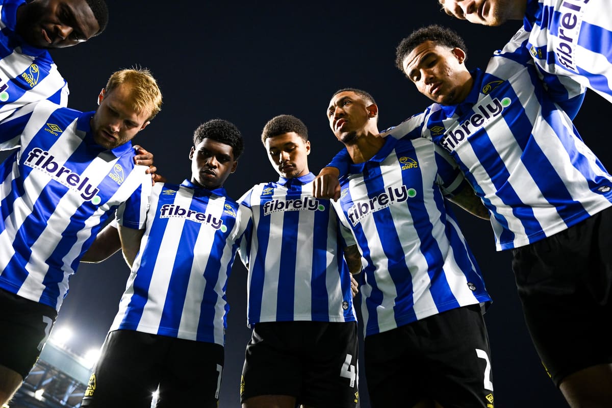 Sheffield Wednesday players in a team huddle at Hillsborough